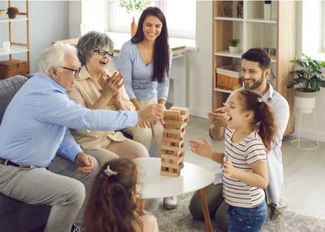 Grandparents playing a game with their grandchildren. 