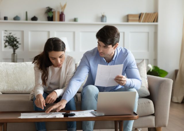 Couple reviewing finances at home