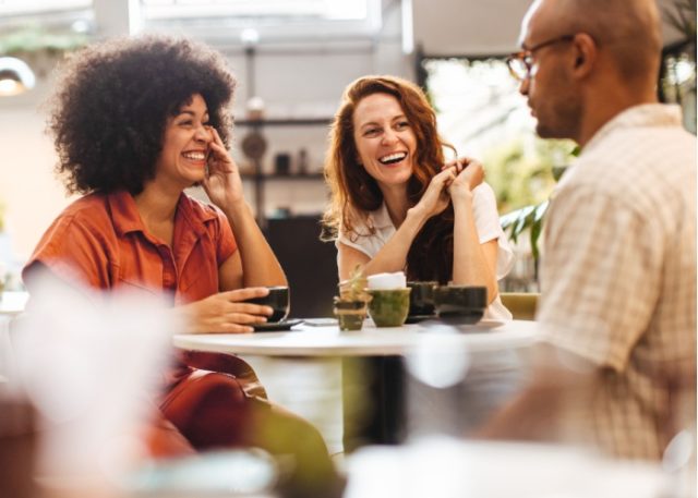 A group of friends talking in a café.