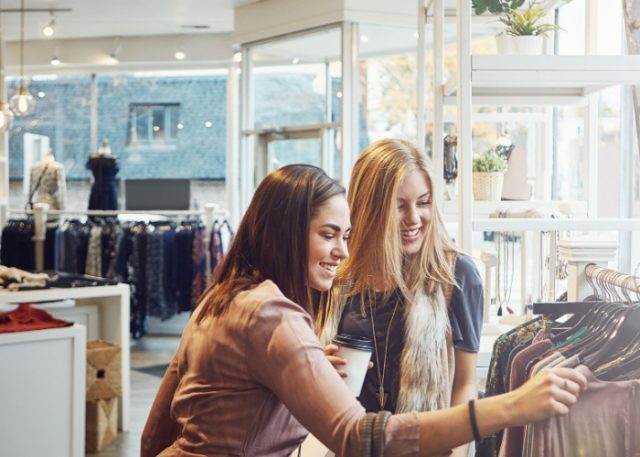 Two women clothes shopping.
