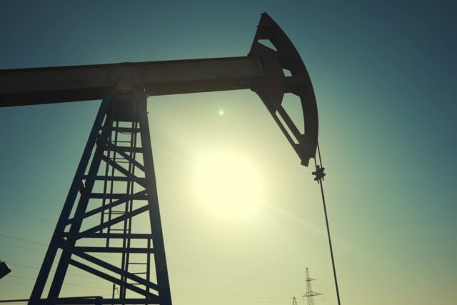 A silhouette of an oil pump.