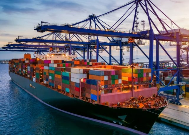 A container cargo ship at a commercial dock.