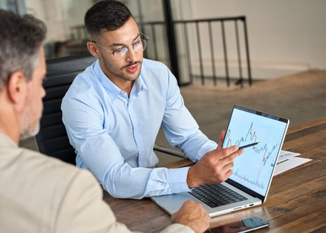 A financial adviser using a graph to explain investment performance.