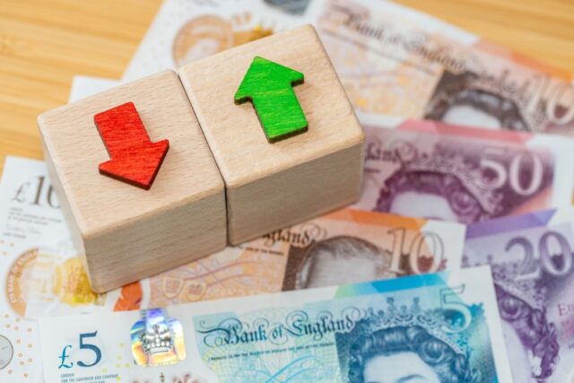 UK bank notes with arrows going up and down.